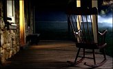 A rocking chair on a porch in "The Village"